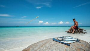 A lone survivor on a deserted island, using a makeshift spear to catch fish in shallow waters, with a primitive fire burning on the shore, and a variety of caught seafood laid out on a rock.