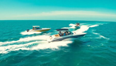 A vibrant and action-packed scene featuring powerboats speeding through the crystal-clear waters of the Florida Keys, with participants enjoying various activities under the sunny skies of Key Largo.