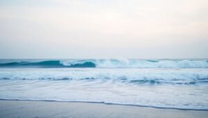 Create an image of a serene beachscape with a subtle, ominous wave approaching in the distance, symbolizing the unexpected and devastating nature of the 2004 Boxing Day tsunami.